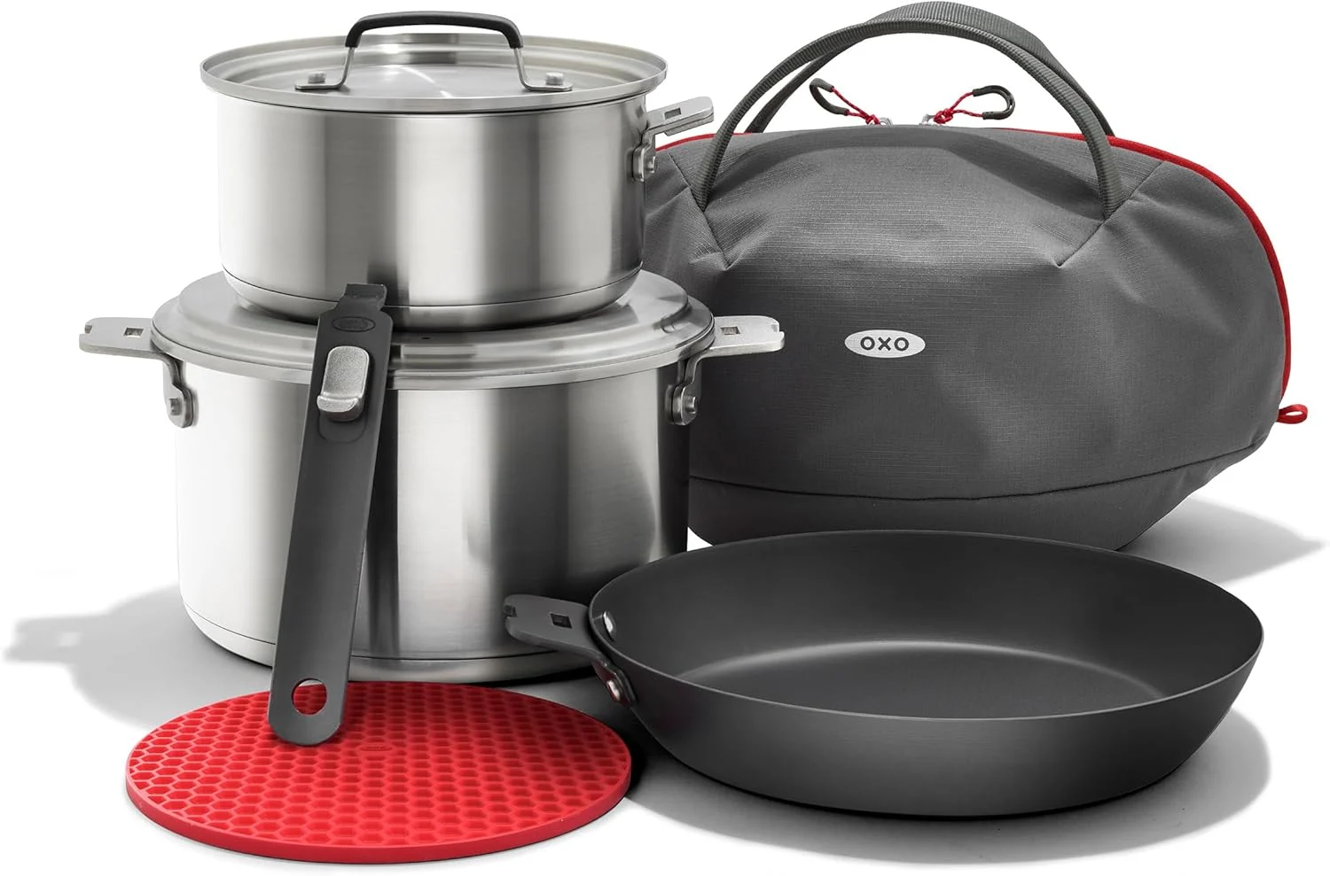 OXO Outdoor 8 Piece Camping Cookware Set, 10″ Pre-Seasoned Carbon Steel Frying Pan Skillet, 2.25QT and 5QT Stainless Steel Saucepans with Lids, Removeable Handle, Trivet, Travel Bag, Space-Saving